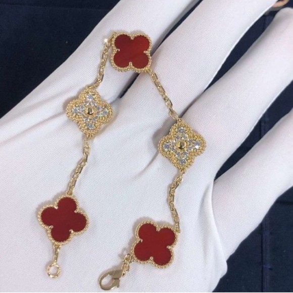 Anthropologie Jewelry - Gold and Red Bracelet four clover